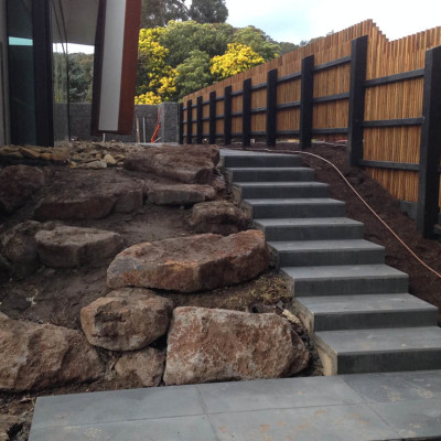 Concrete and stone landscaping for house in Lorne